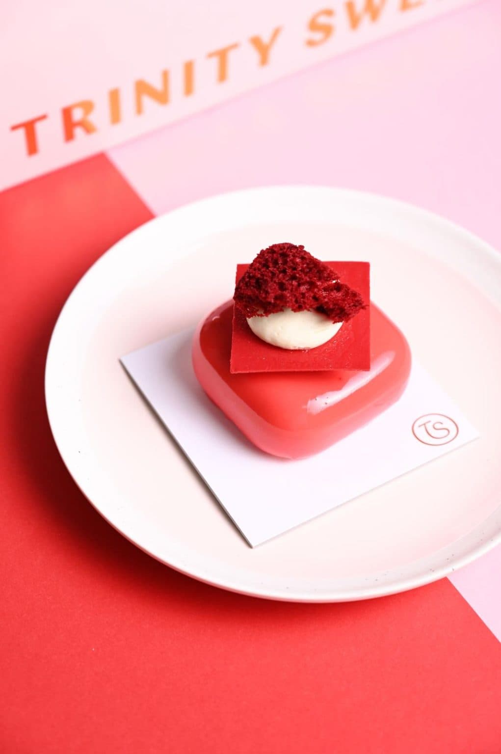 Luxurious layered dessert with dark chocolate glaze